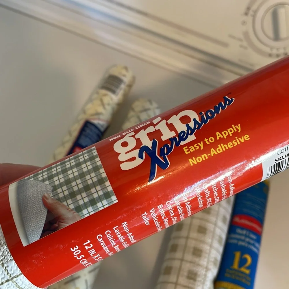 Five rolls of Rubbermaid shelf liner, some adhesive some not 3 full new rolls